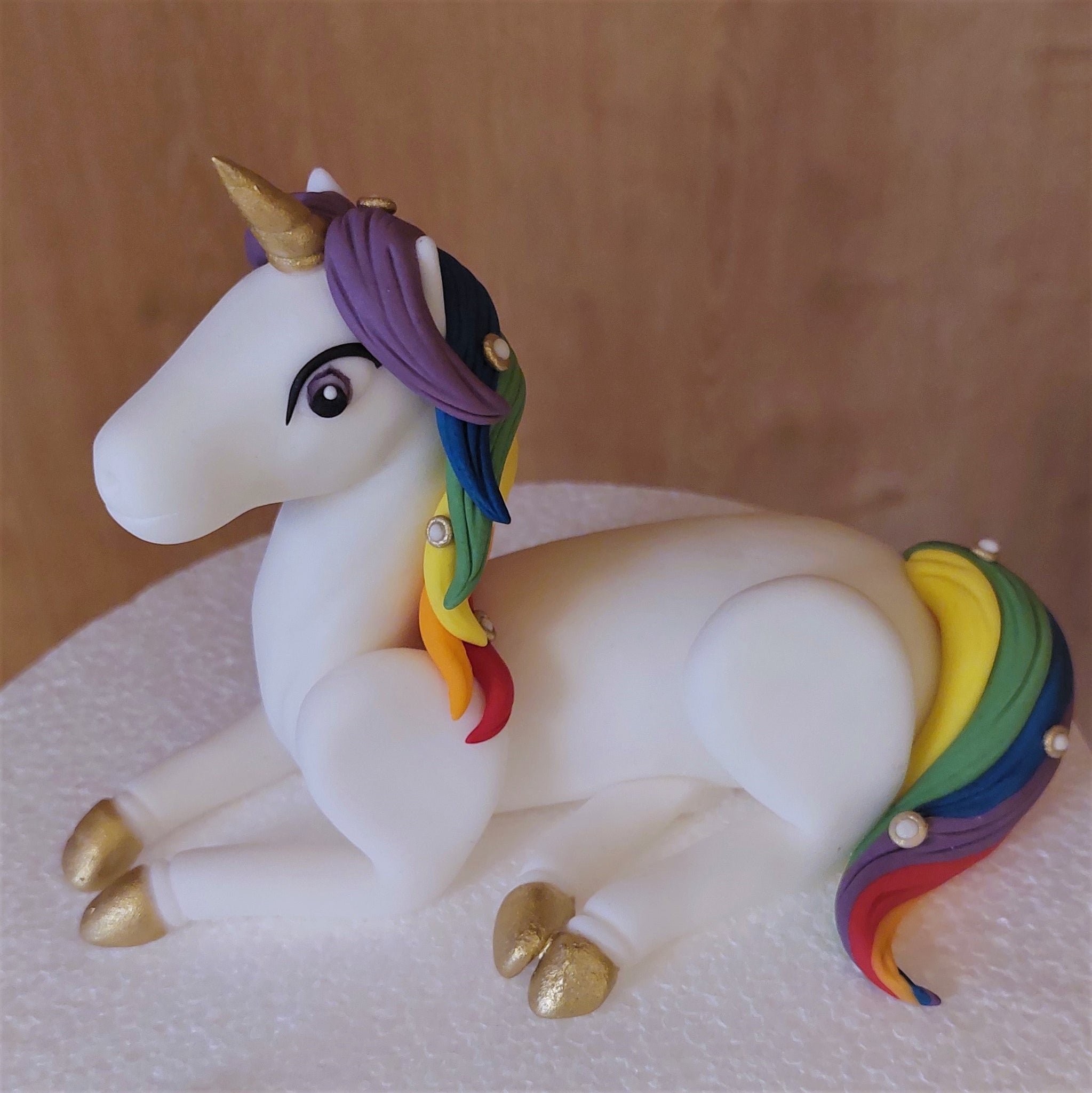Fondant rainbow unicorn cake topper