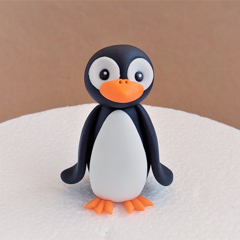 Fondant penguin cake topper