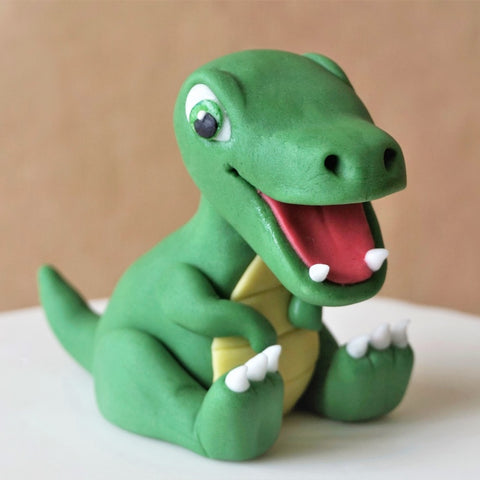 Fondant baby dinosaur cake topper