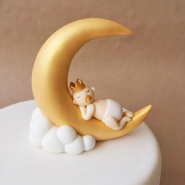 Fondant baby on a moon cake topper