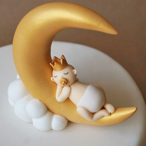 Fondant baby on a moon cake topper