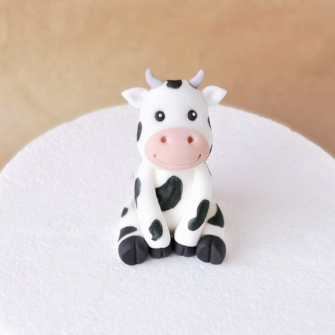 Fondant cow cake topper